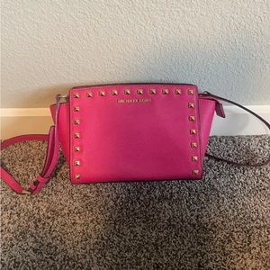 Michael Kors medium pink silver studded Selma bag.